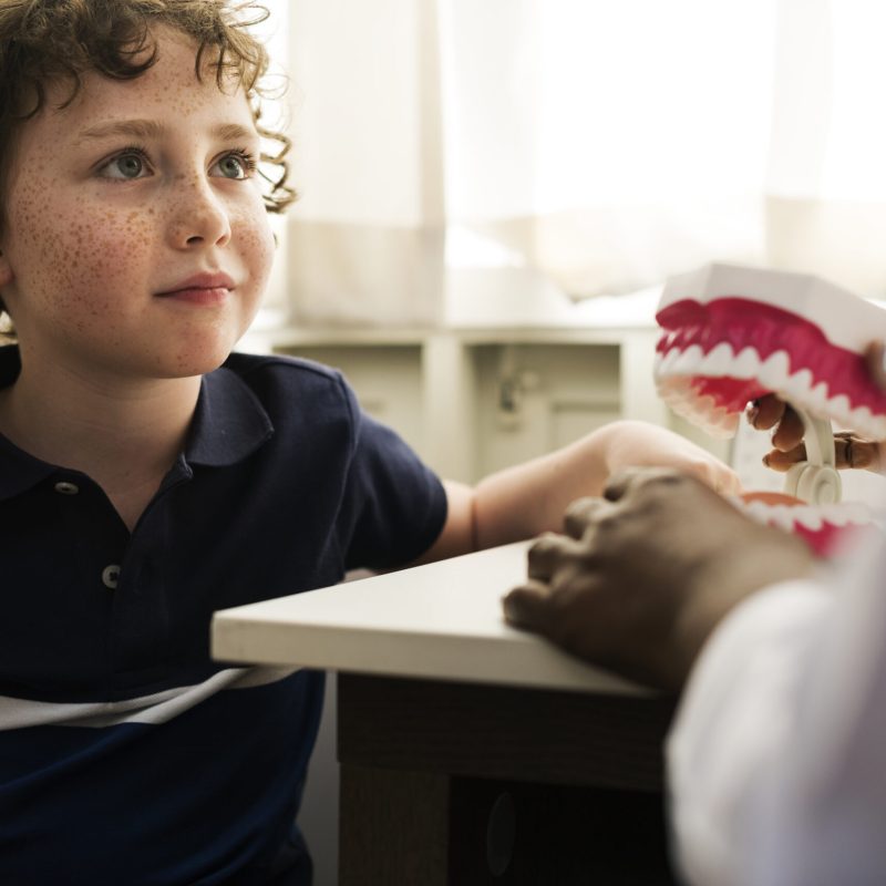 Young boy is meeting a dentist